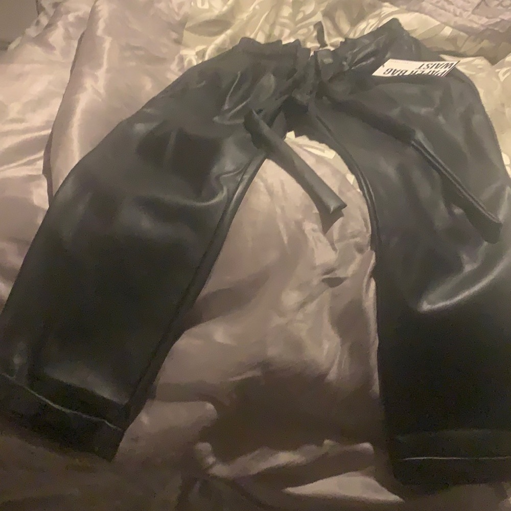 Black paper bag waist like leather pants.